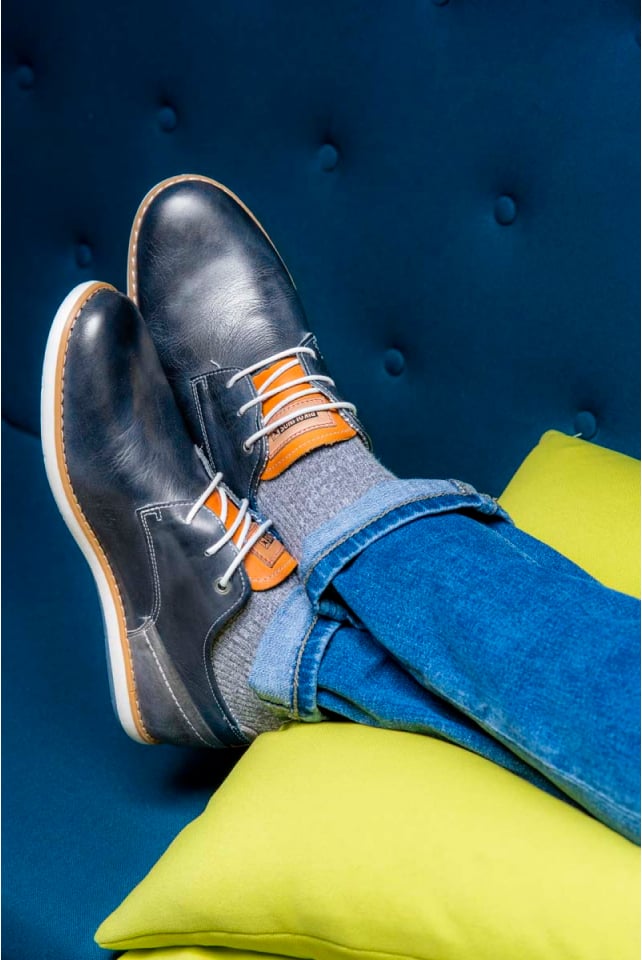 Photograph of blue Pikolinos men's shoes on a cushion