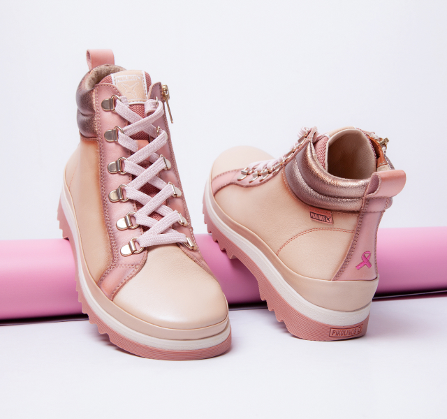 Picture Vigo ankle boots with their features and the pink purse on a white
    background