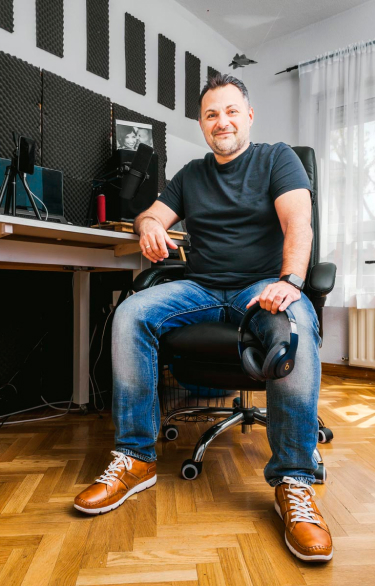 Photograph of Alberto with Pikolinos sneakers sitting on a chair in his studio.