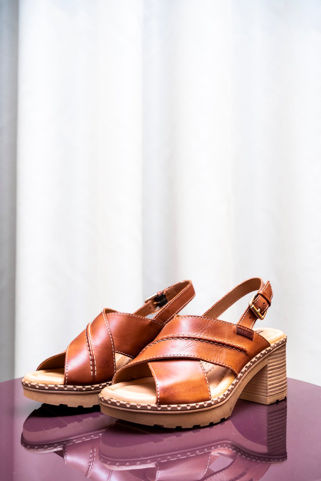 Image of a pair of Pikolinos women's sandals, on a table