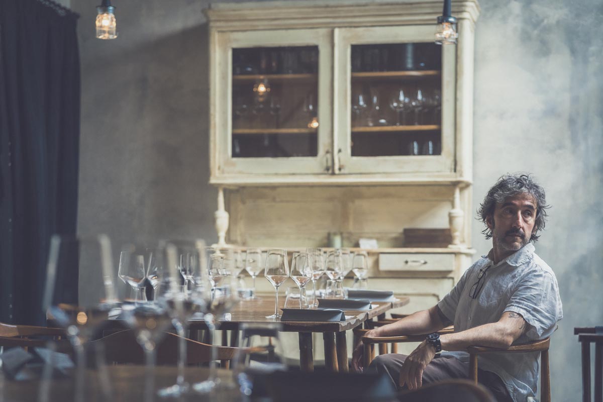 Image of a man sitting at one of the tables in the restaurant.