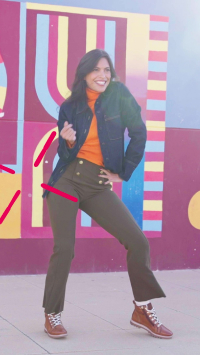 Image of a young woman dancing with Vigo model ankle boots.