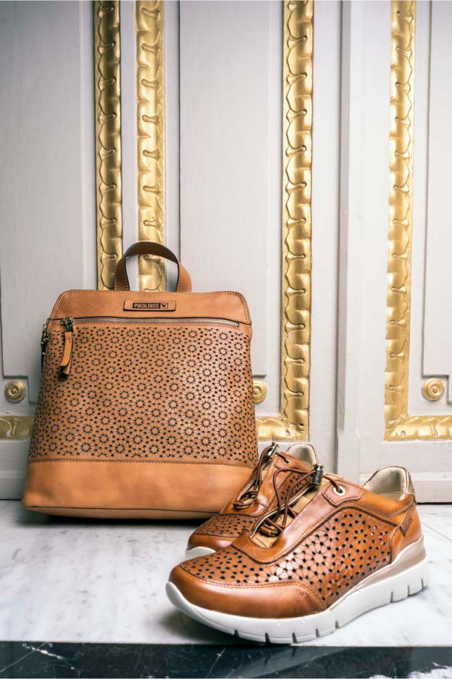 Photograph of women's Pikolinos sneakers and a backpack at the Palacio Salvetti hotel