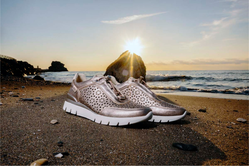 Sportfotografie einer Frau am Strand von La Araña