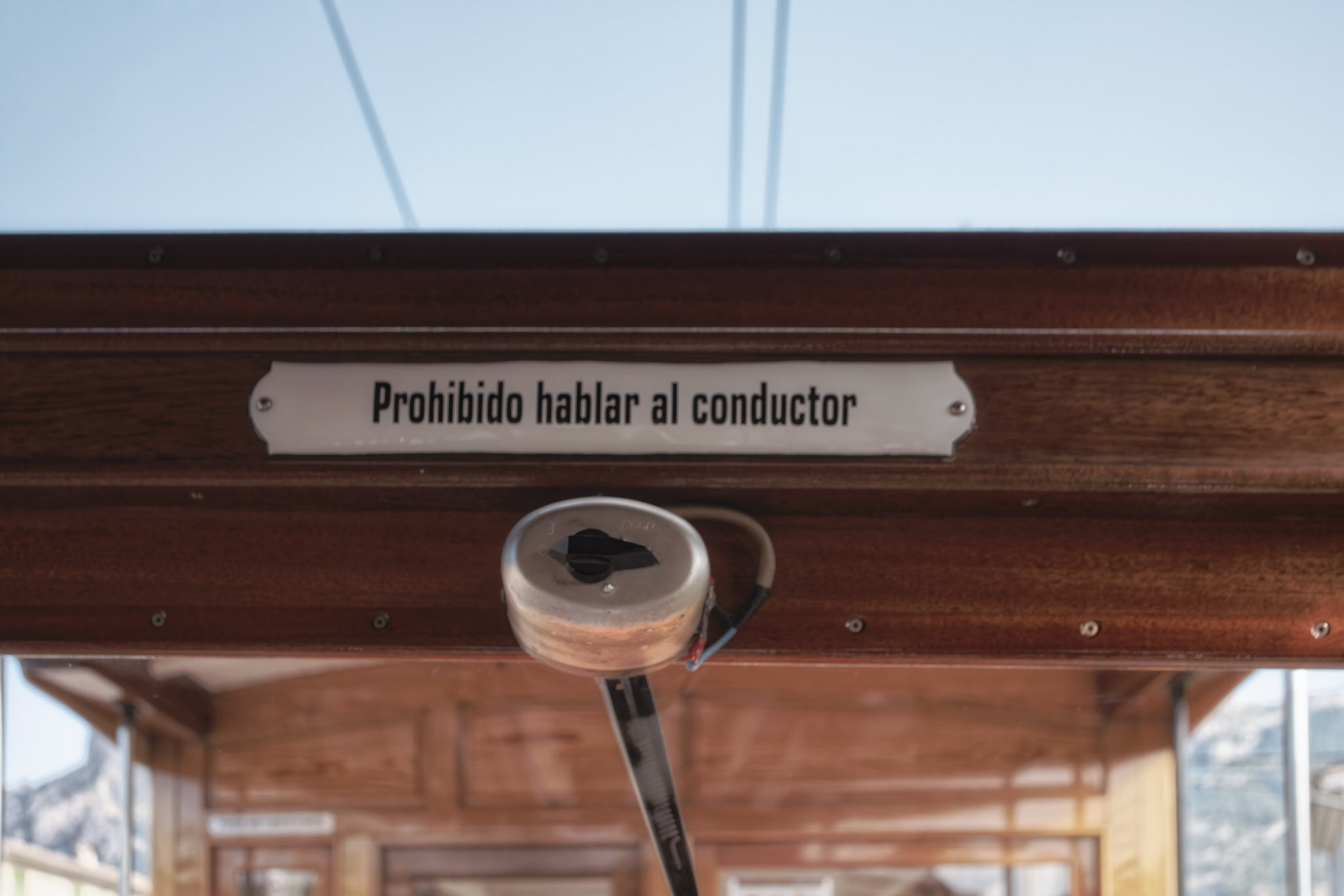 Image of a sign on the Sóller railway that says “forbidden to speak to the driver”