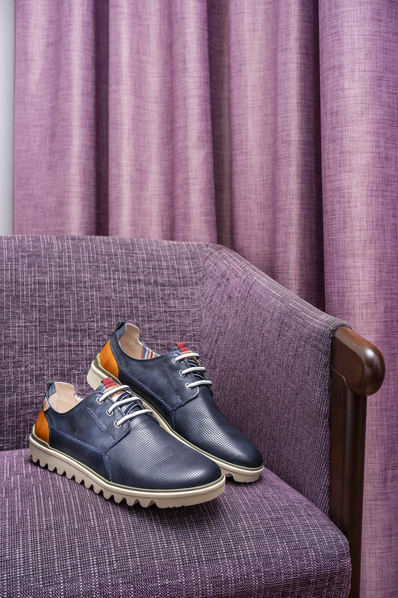 Picture of a man's dress shoe on an armchair at the Murcia Rincón de Pepe Affiliated by Meliá hotel.