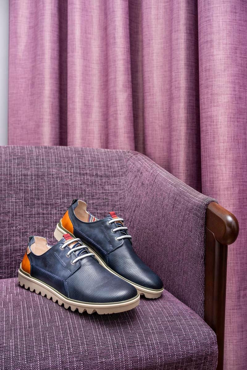 Picture of a man's dress shoe on an armchair at the Murcia Rincón de Pepe Affiliated by Meliá hotel.