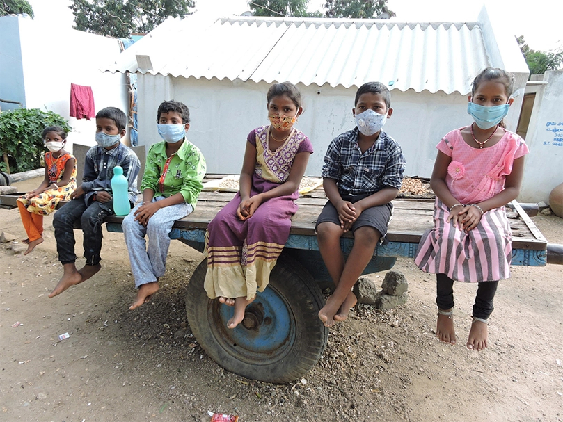 Group of six children posing in front of the camera